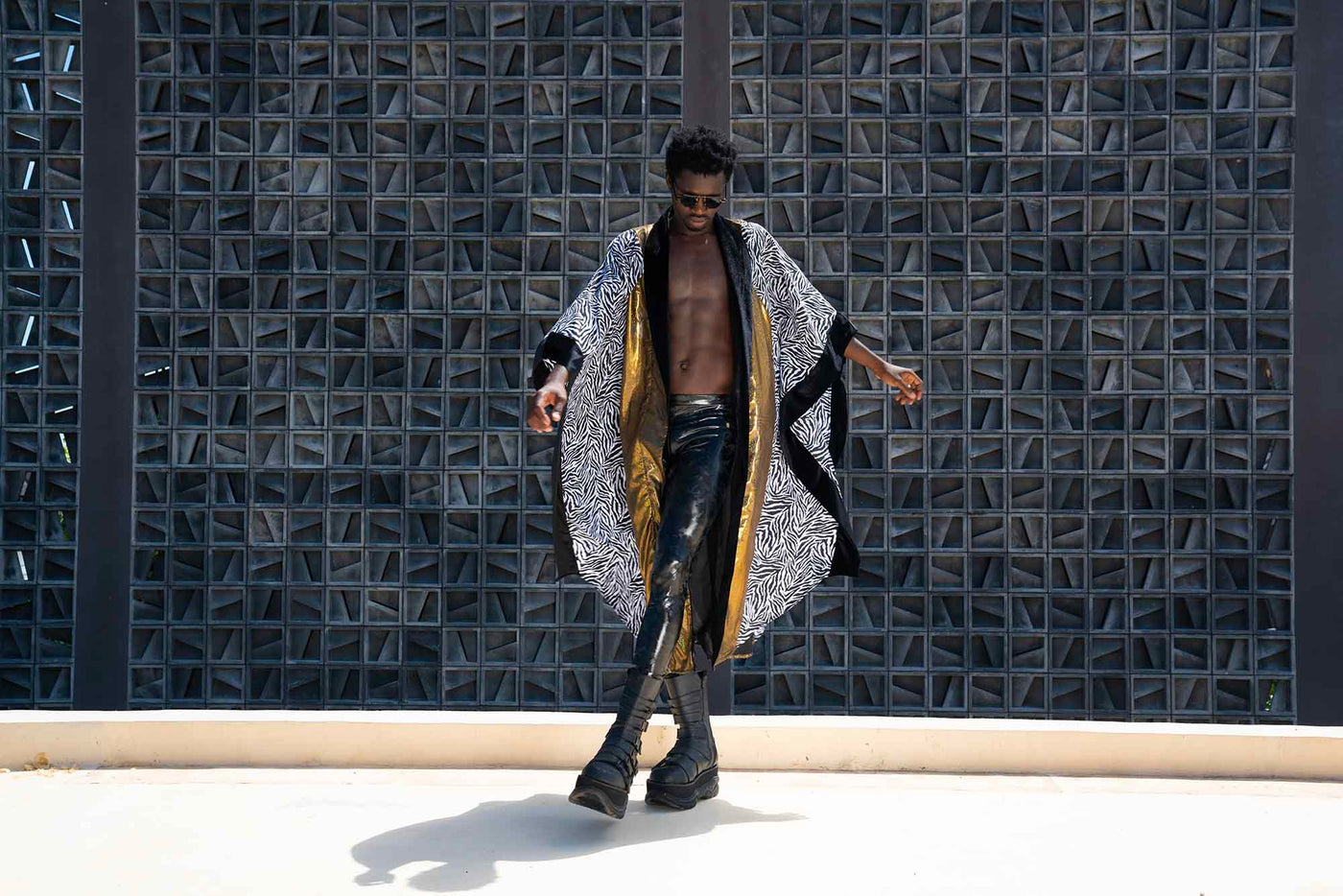 man wearing a black and white zebra print festival kimono from Love Khaos