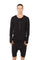 Man wearing a mens long sleeve henley from Ekoluxe