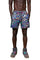 A man wearing psychedelic shorts with rainbow reflective panels from Love Khaos.