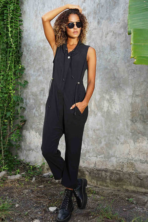 woman wearing a black utility jumpsuit from Ekoluxe