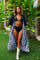 woman wearing a zebra print kimono with feathers from Love Khaos.