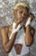 Studded white leather fingerless gloves from Love Khaos festival clothing and streetwear brand.